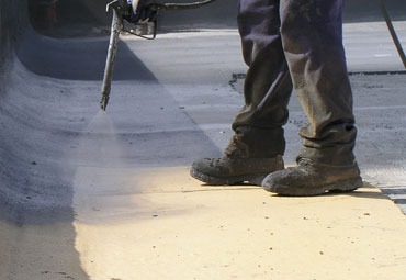 Coating systems over Peoria spray foam roof systems