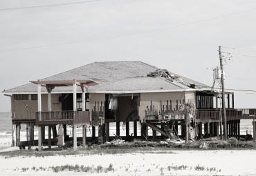 Wind damage - spray foam can help prevent uplift to Peoria roofs